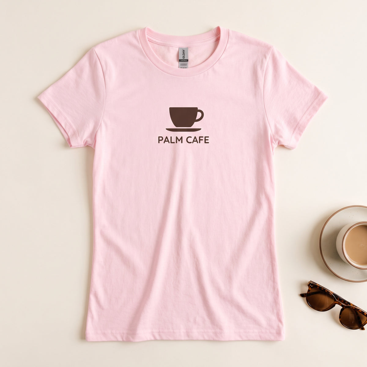 Custom women's Gildan 64000L t-shirt in light pink with a cafe logo