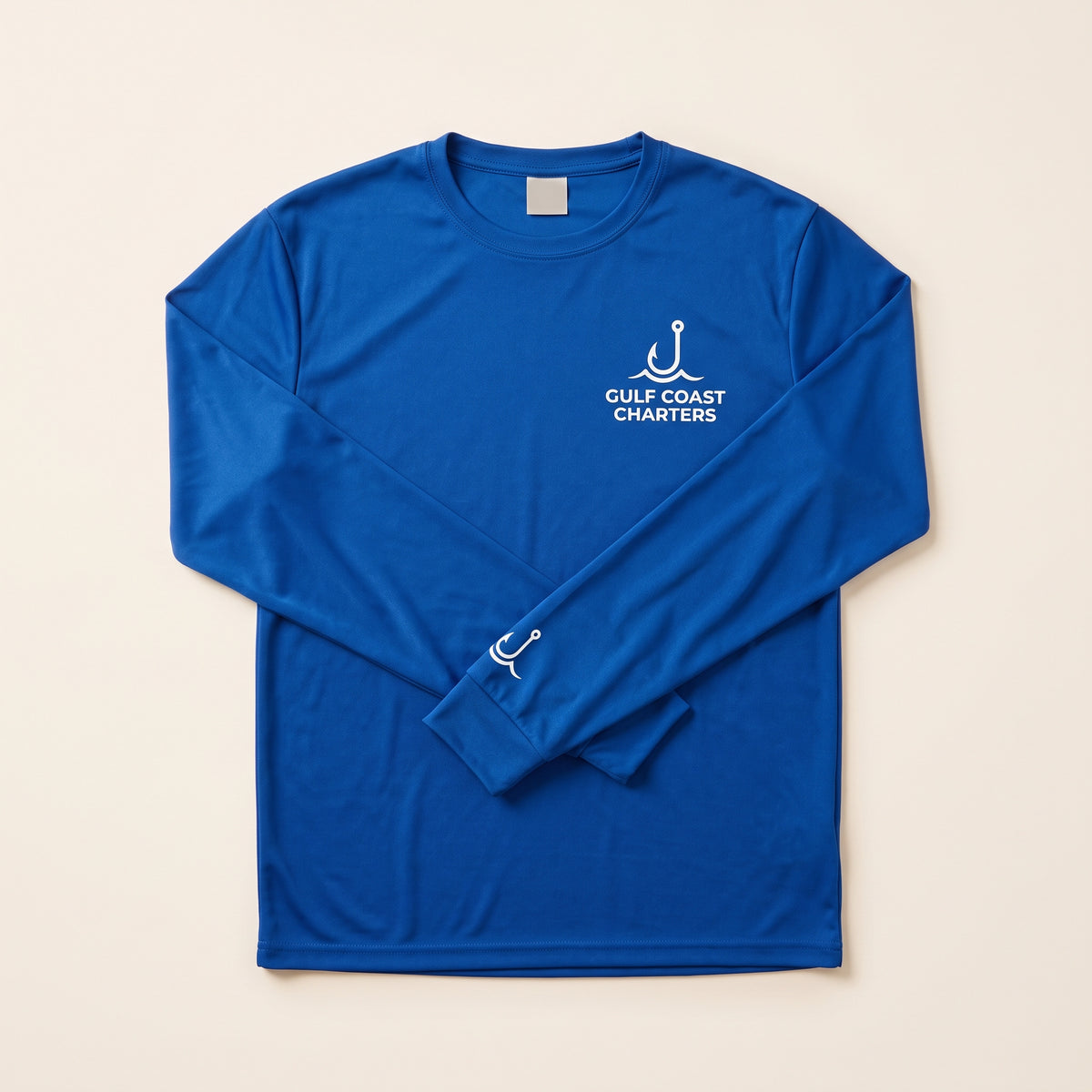 Custom long sleeve Dri-FIT performance shirt in royal blue with chest and sleeve logo