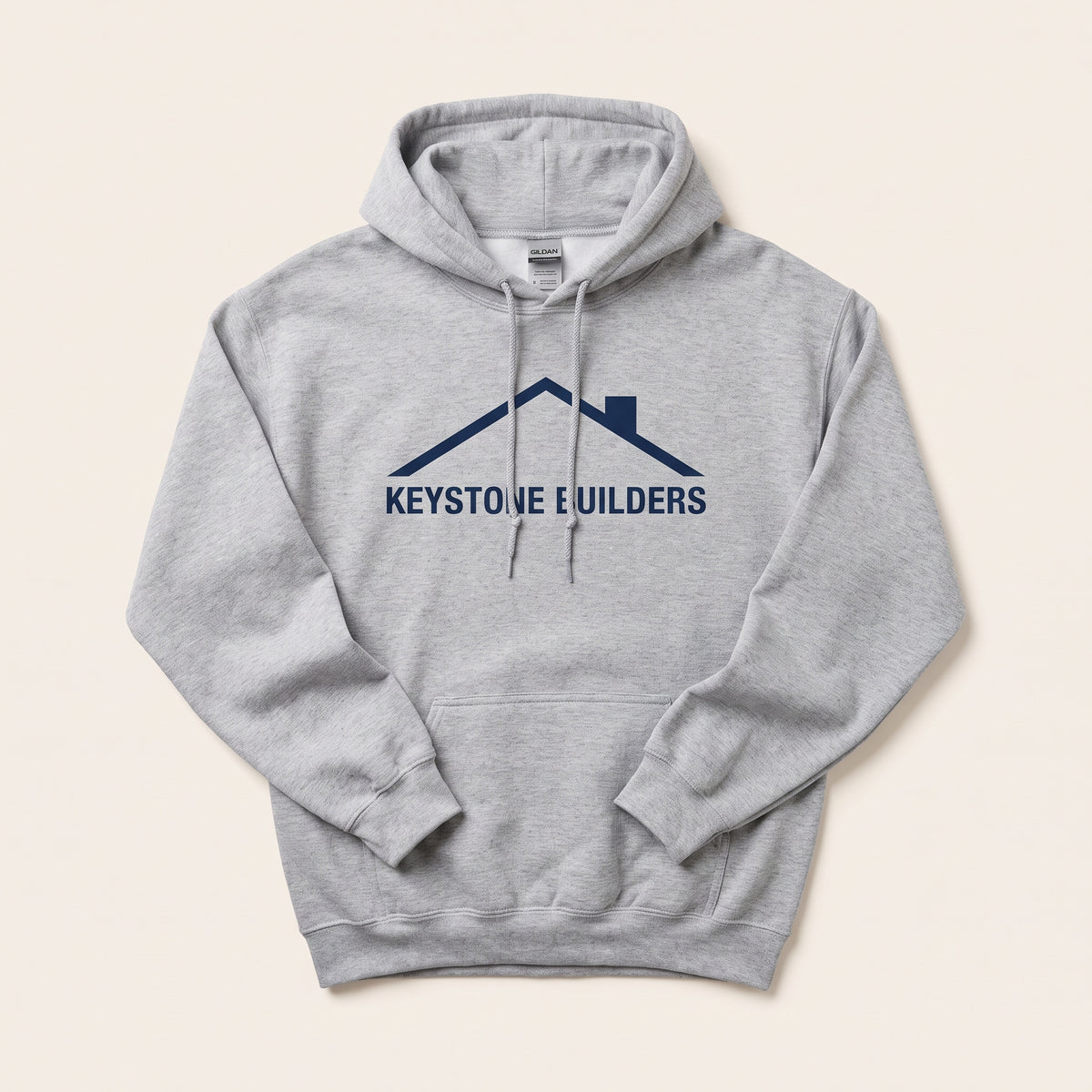 Custom Gildan 18500 hoodie in sport grey with a navy construction company logo
